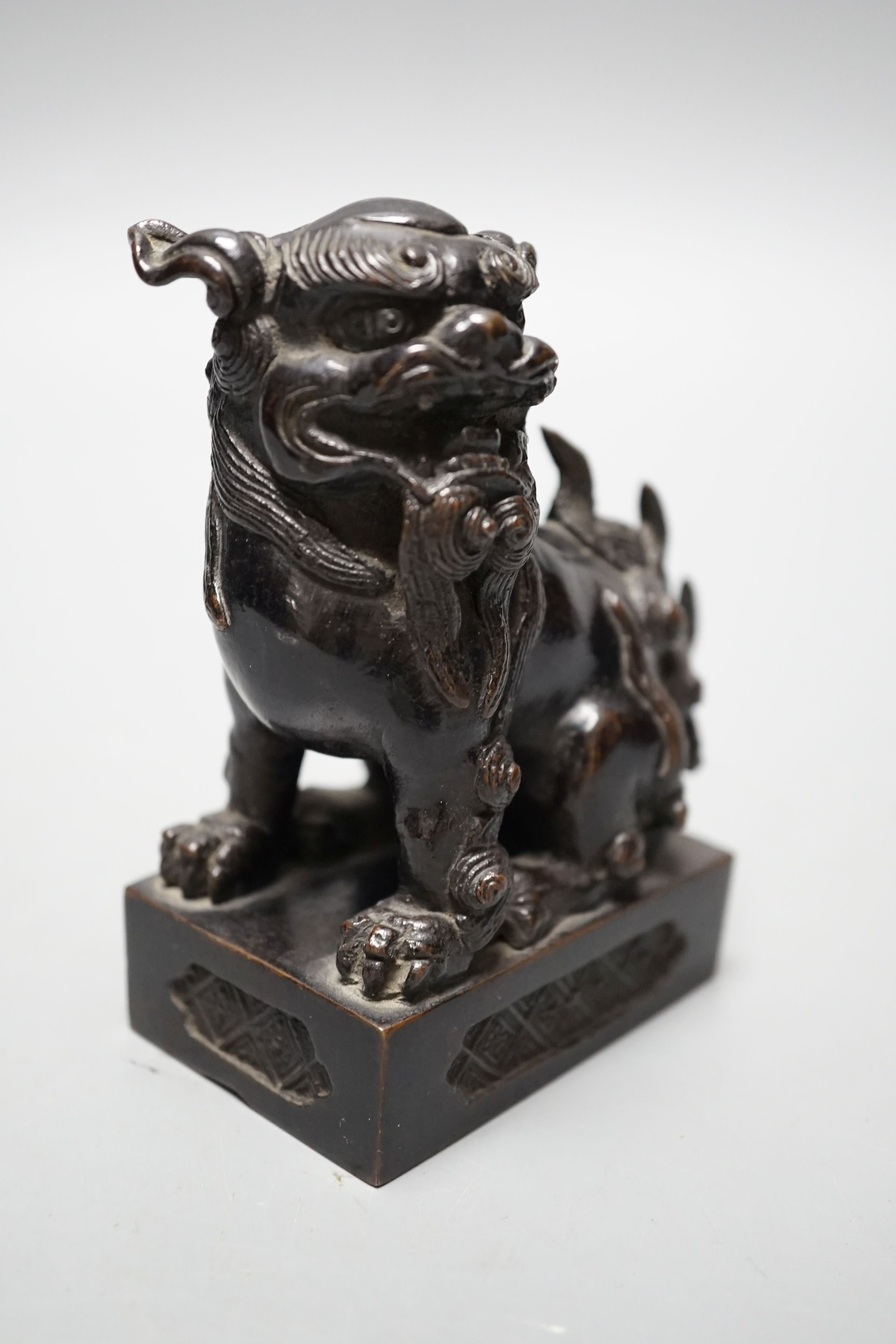 A Japanese bronze Buddhistic lion, Nogara, Noburu mark to base, 11cm